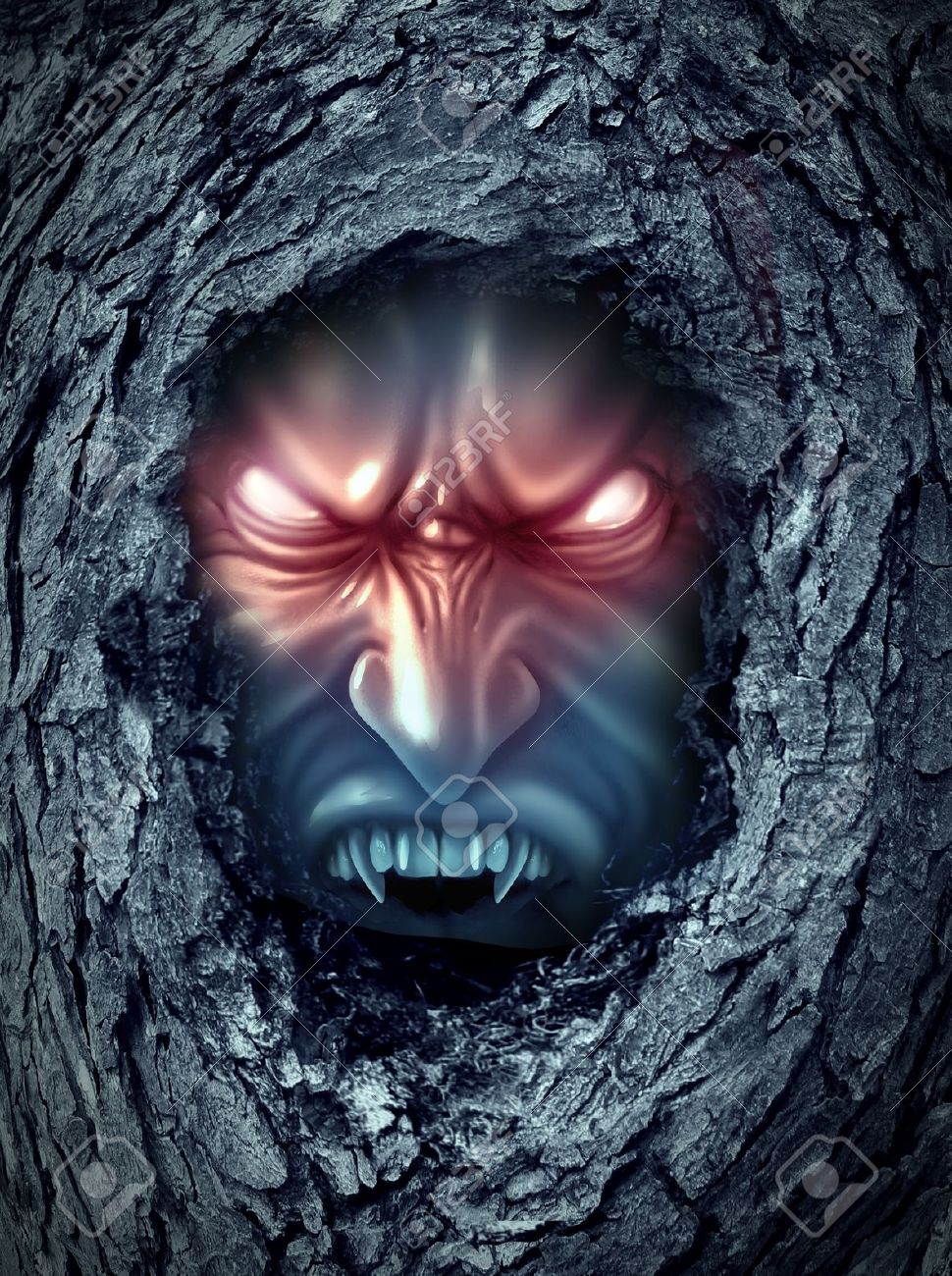 19986425-Vampire-zombie-ghost-with-glowing-evil-eyes-living-inside-a-dark-old-haunted-tree-trunk-as-a-hallowe-Stock-Photo.jpg