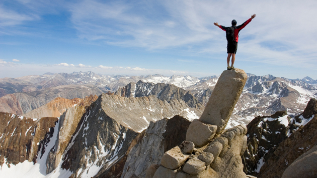 man-standing-on-edge-of-cliff.jpg