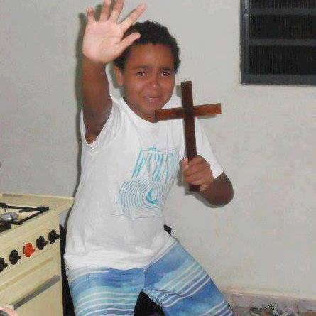 scared-kid-holding-a-cross.jpg