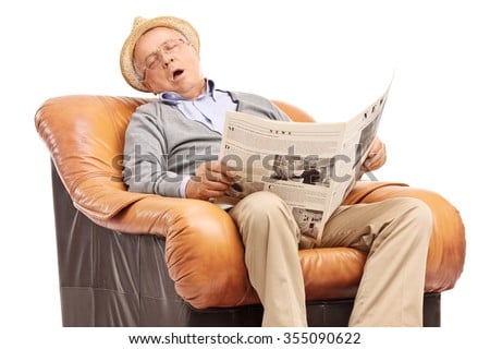 stock-photo-studio-shot-of-a-senior-man-sleeping-on-an-armchair-and-holding-a-newspaper-in-his-hands-isolated-355090622.jpg