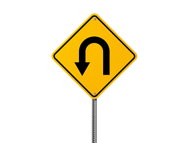 yellow-u-turn-sign-isolated-on-white-background-picture-id638084398