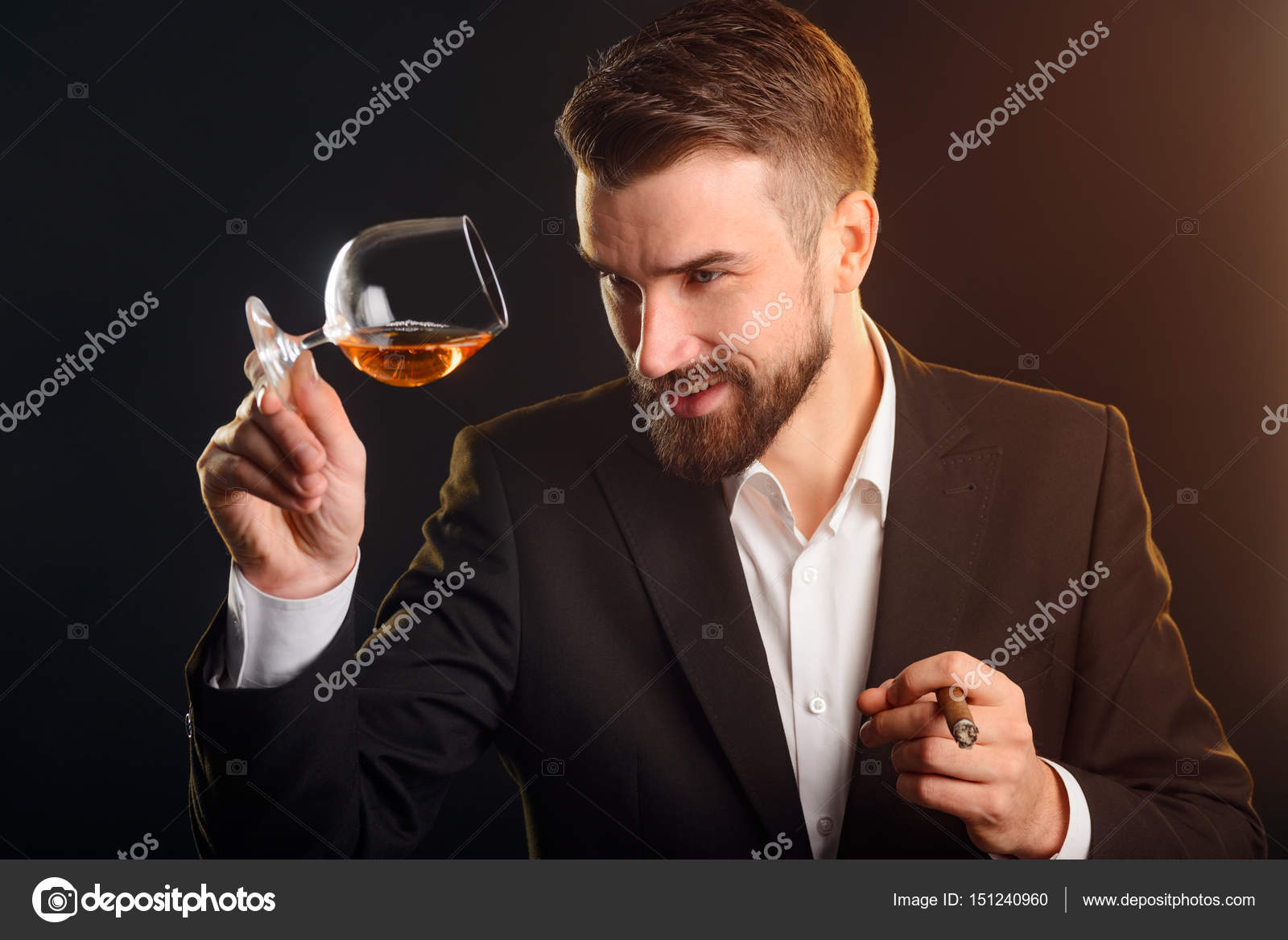 depositphotos_151240960-stock-photo-man-holding-cognac-glass-stylish.jpg